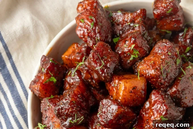 Crispy Pork Belly Bites Recipe: Savory Bite-Size Pork Treats 3 A pan filled with meat bites.