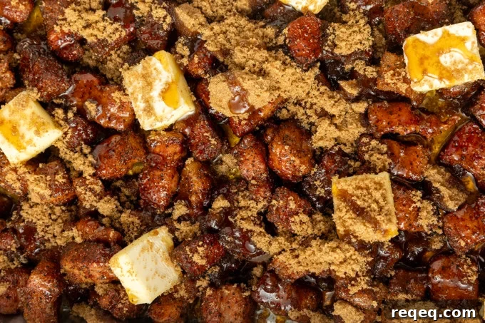 Crispy Pork Belly Bites Recipe: Savory Bite-Size Pork Treats 6 A pan filled with meat and butter.