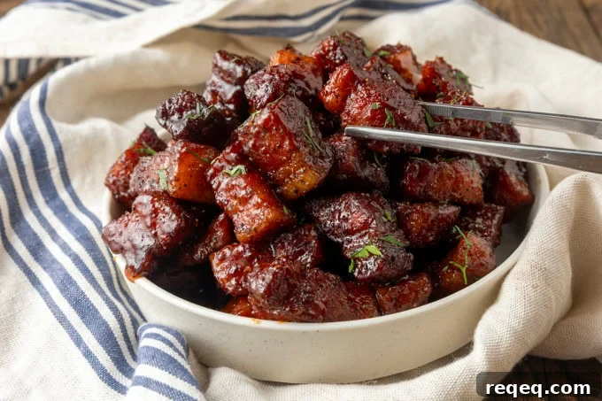 Crispy Pork Belly Bites Recipe: Savory Bite-Size Pork Treats 7 smoked pork belly bites in a bowl.