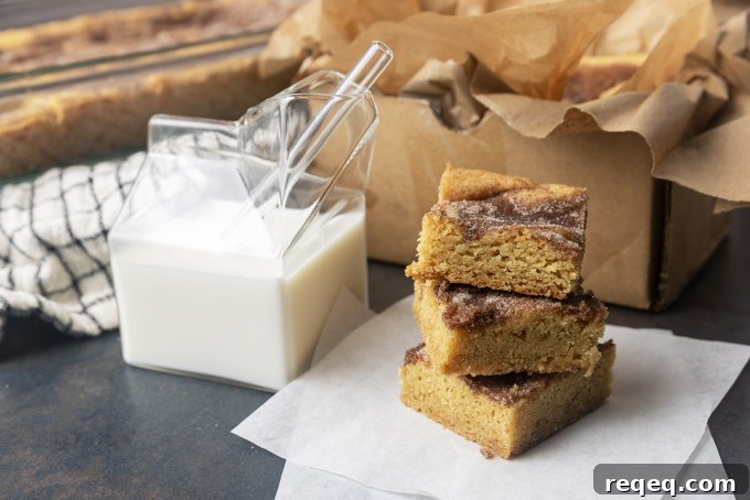 snickerdoodle cookie bars with a glass jar of milk