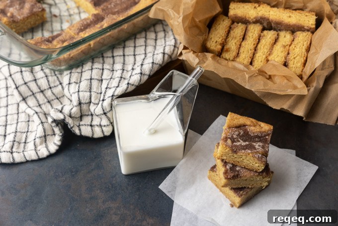 snickerdoodle cookie bars with a glass jar of milk