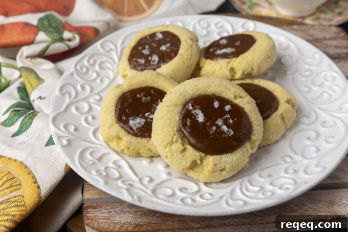 Dulce de Leche Cookie Recipe: Chewy Caramel Treats for Dessert 2 dulce de leche thumprint shortbread cookies on a plate