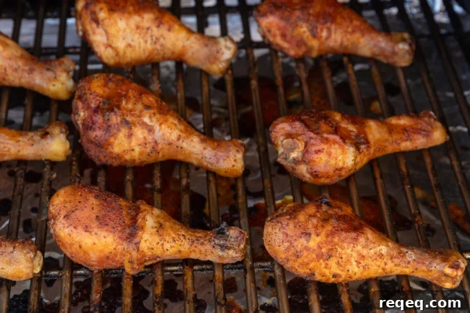 smoked chicken drumsticks on a grill