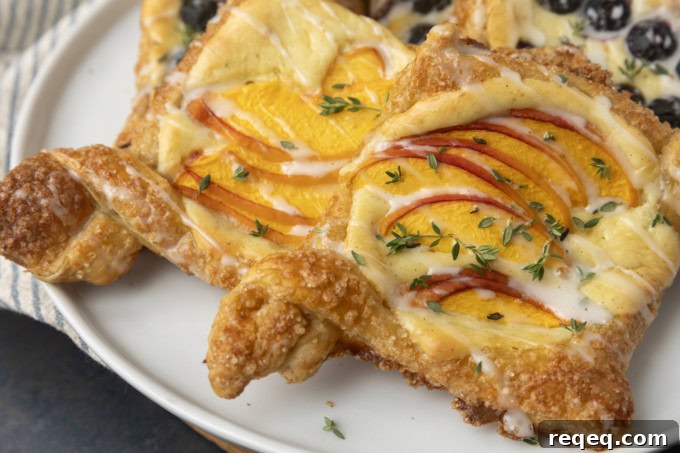Flaky Cream Cheese Pastries: Quick Recipe for Homemade Treats 2 peach cream cheese puff pastry with thyme on plate