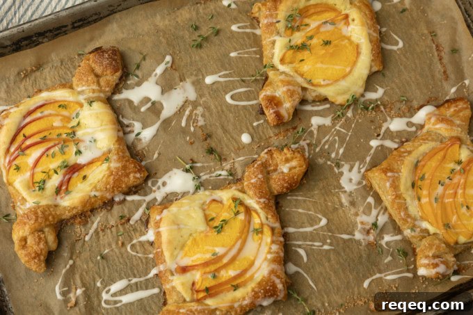 Flaky Cream Cheese Pastries: Quick Recipe for Homemade Treats 9 peach cream cheese puff pastry with thyme on parchment lined pan
