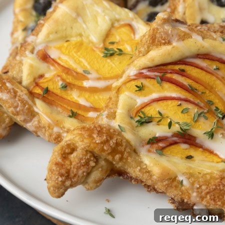 peach cream cheese puff pastry with thyme on plate