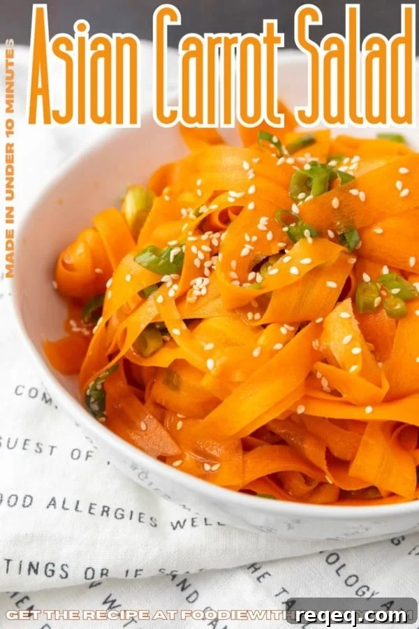 Crisp Asian Carrot Salad with Sesame Ginger Dressing 6 carrot ribbon salad in a white bowl with text overlay describing the photo
