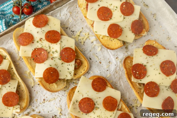 Savory Pizza Sandwich Recipe: Crispy, Cheesy, and Quick 4 pizza sub sandwiches on parchment on a pan