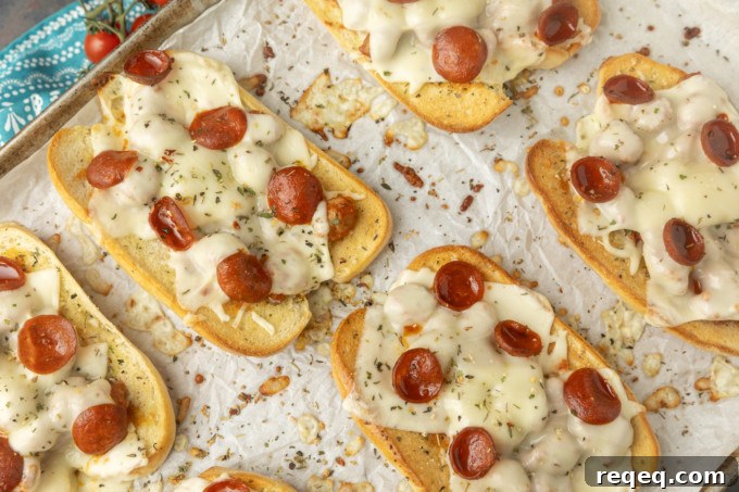 Savory Pizza Sandwich Recipe: Crispy, Cheesy, and Quick 5 toasted pizza sub sandwiches on parchment on a pan