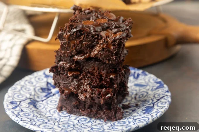 Fudgy Greek Yogurt Brownies with Extra Moist Texture 2 Greek yogurt brownies eggless brownies on a plate
