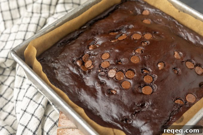 Fudgy Greek Yogurt Brownies with Extra Moist Texture 3 Greek yogurt brownies eggless brownies in a pan lined with parchment