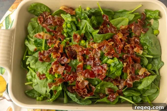spinach and crispy prosciutto in a pan for high protein egg bake