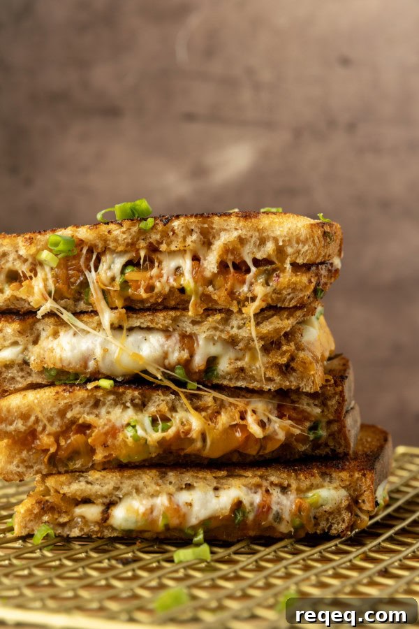 Kimchi Grilled Cheese Sandwich Recipe for Crispy, Spicy Melt 6 stack of kimchi grilled cheese on a cooling rack.