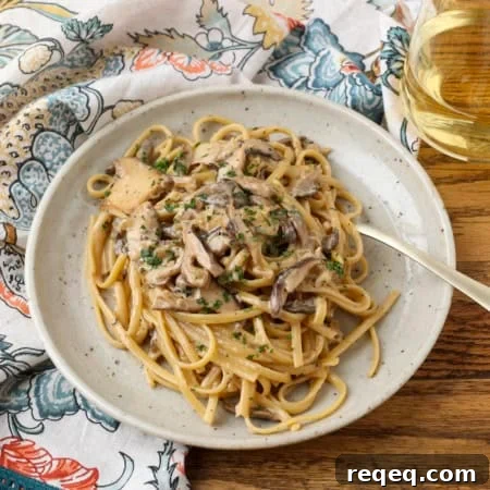 Creamy Miso Mushroom Pasta with Garlic and Thyme 5 miso mushroom pasta with a fork on a plate with a glass of white wine