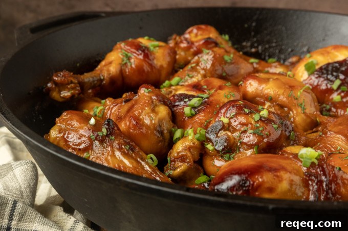 baked honey garlic chicken in a cast-iron pan