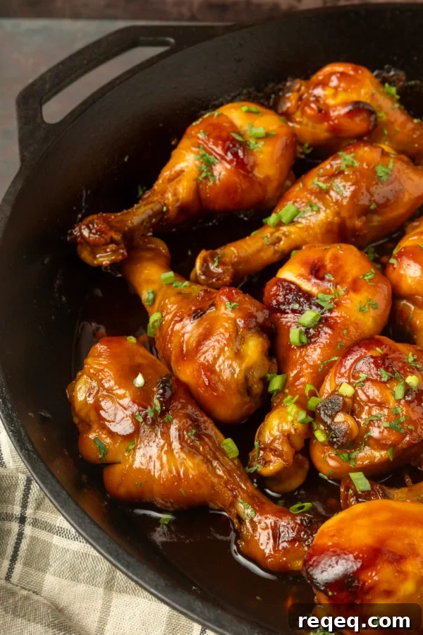 baked honey garlic chicken in a cast-iron pan