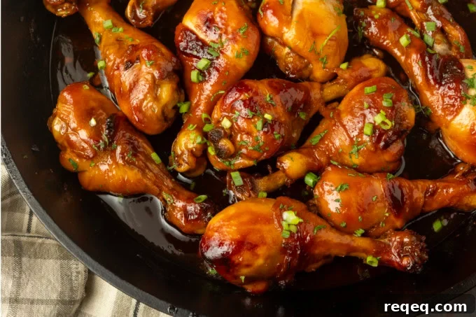 baked honey garlic chicken in a cast-iron pan