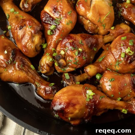 baked honey garlic chicken in a cast-iron pan