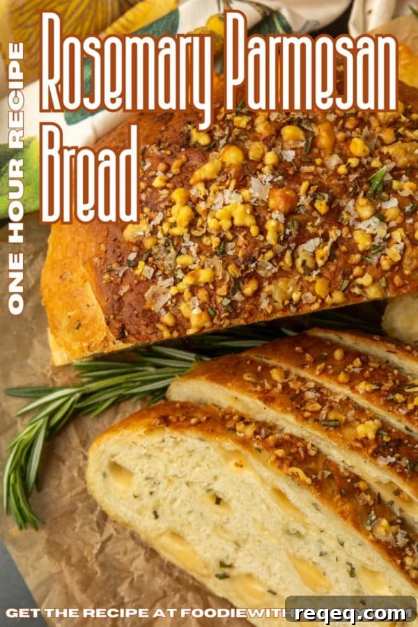 Rosemary Parmesan Artisan Bread Recipe for Crispy Crust and Flavor 11 partially sliced one hour rosemary parmesan bread on parchment paper with text describing the photo over it