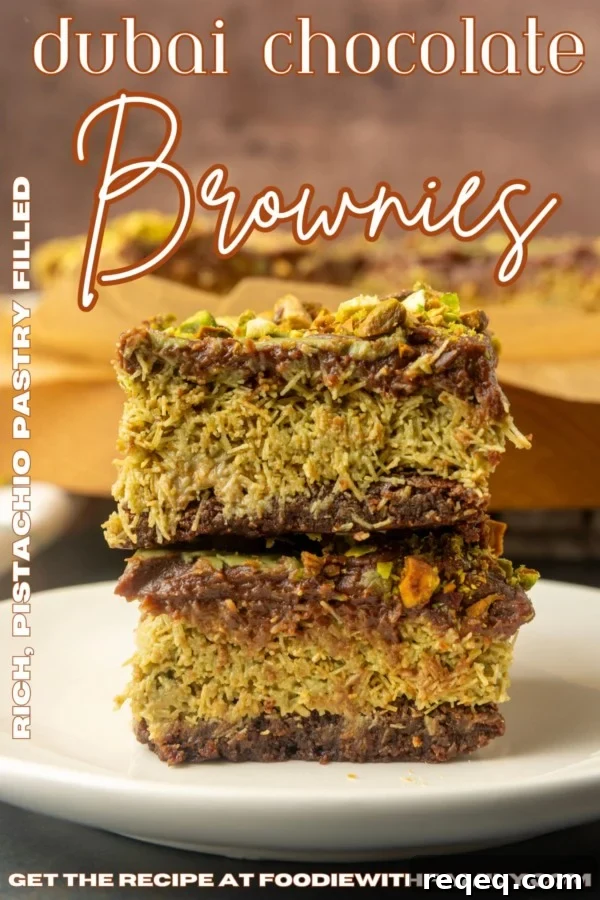 Decadent Dubai Chocolate Brownies Recipe — Rich, Fudgy Squares 11 Viral Dubai Chocolate Brownies on parchment paper and stacked on a plate with text overlay describing the photo