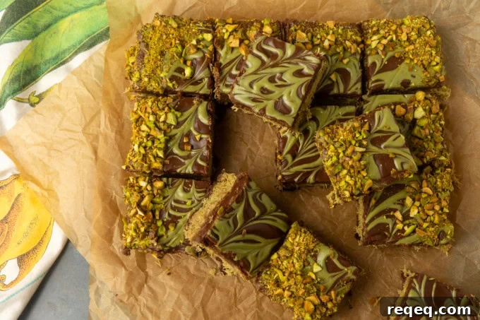 Decadent Dubai Chocolate Brownies Recipe — Rich, Fudgy Squares 4 Viral Dubai Chocolate Brownies on parchment paper