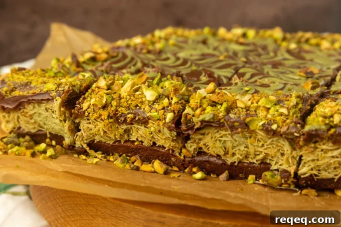Decadent Dubai Chocolate Brownies Recipe — Rich, Fudgy Squares 9 Viral Dubai Chocolate Brownies on parchment paper