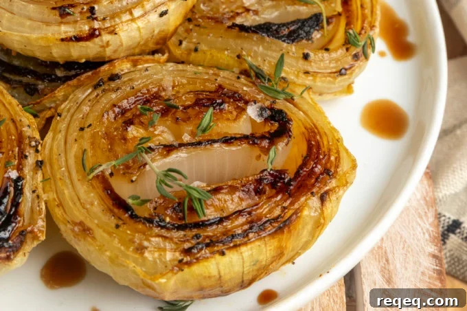 Crispy Oven-Roasted Onions with Garlic and Herbs 3 baked onions on a plate