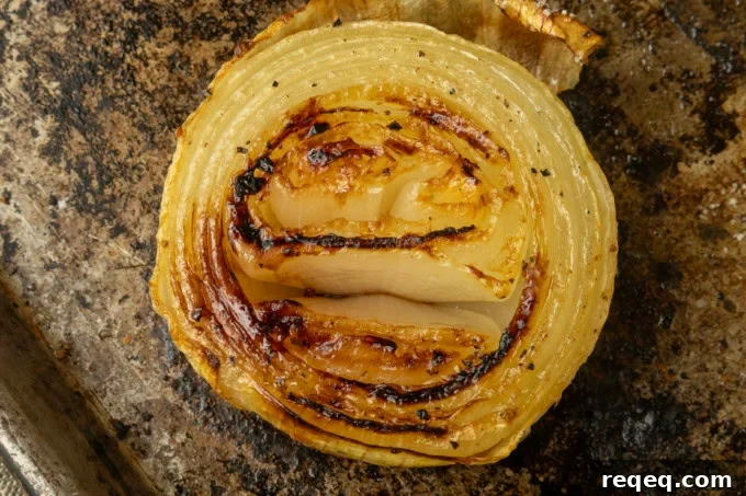Crispy Oven-Roasted Onions with Garlic and Herbs 4 baked onions on a pan