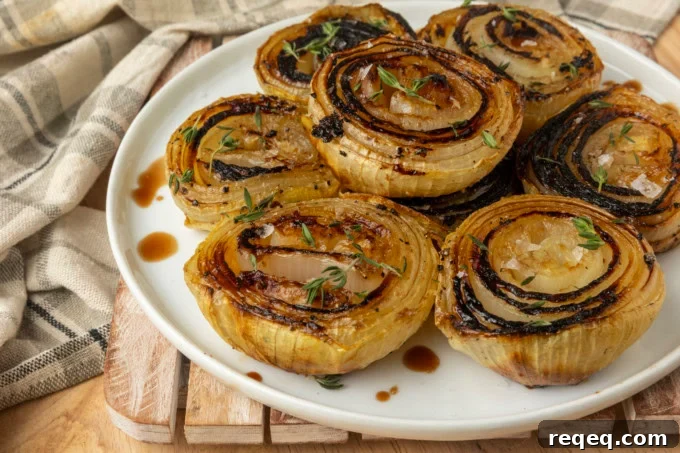 Crispy Oven-Roasted Onions with Garlic and Herbs 5 baked onions on a plate