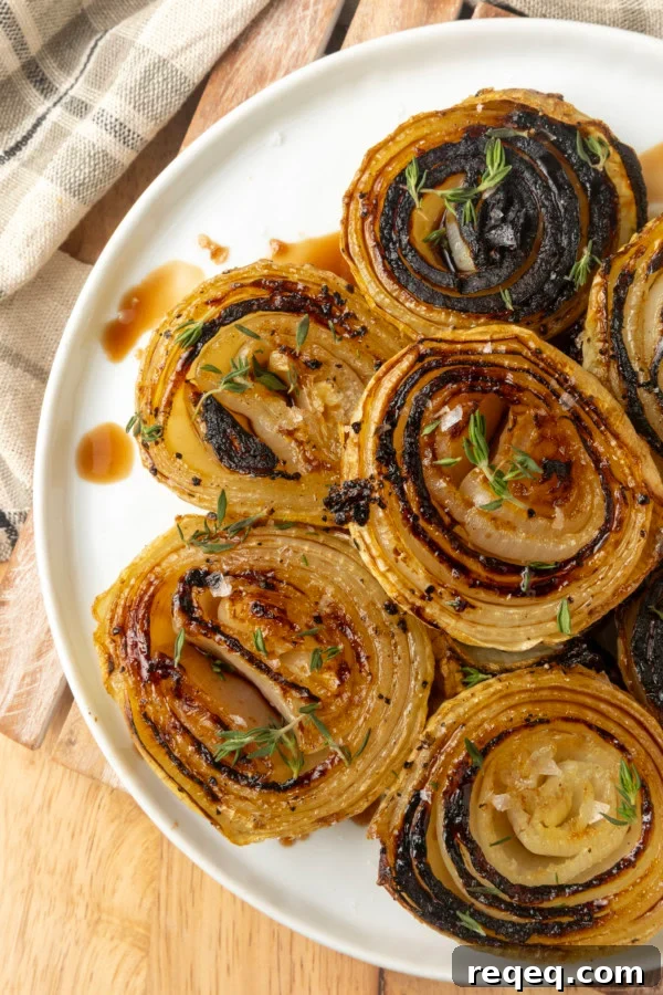 Crispy Oven-Roasted Onions with Garlic and Herbs 6 baked onions on a plate