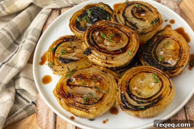 Crispy Oven-Roasted Onions with Garlic and Herbs 7 baked onions on a plate