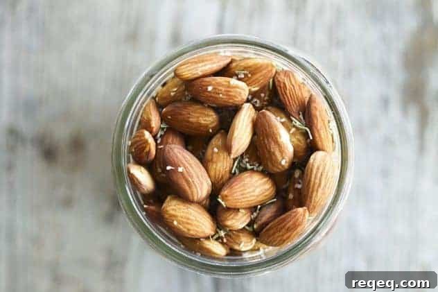 These fragrant and toasty rosemary garlic almonds slow-roast in an ultra low oven overnight while you sleep.