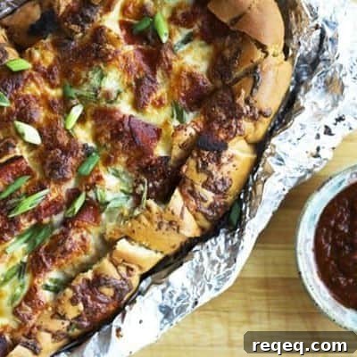 Cheesy Pizza Party Pull-Apart Bread Recipe 2 Pizza Party Bread: ooey, gooey, melted mozzarella and crispy pepperoni on buttery garlic bread that is made to be torn apart and shared by friends.